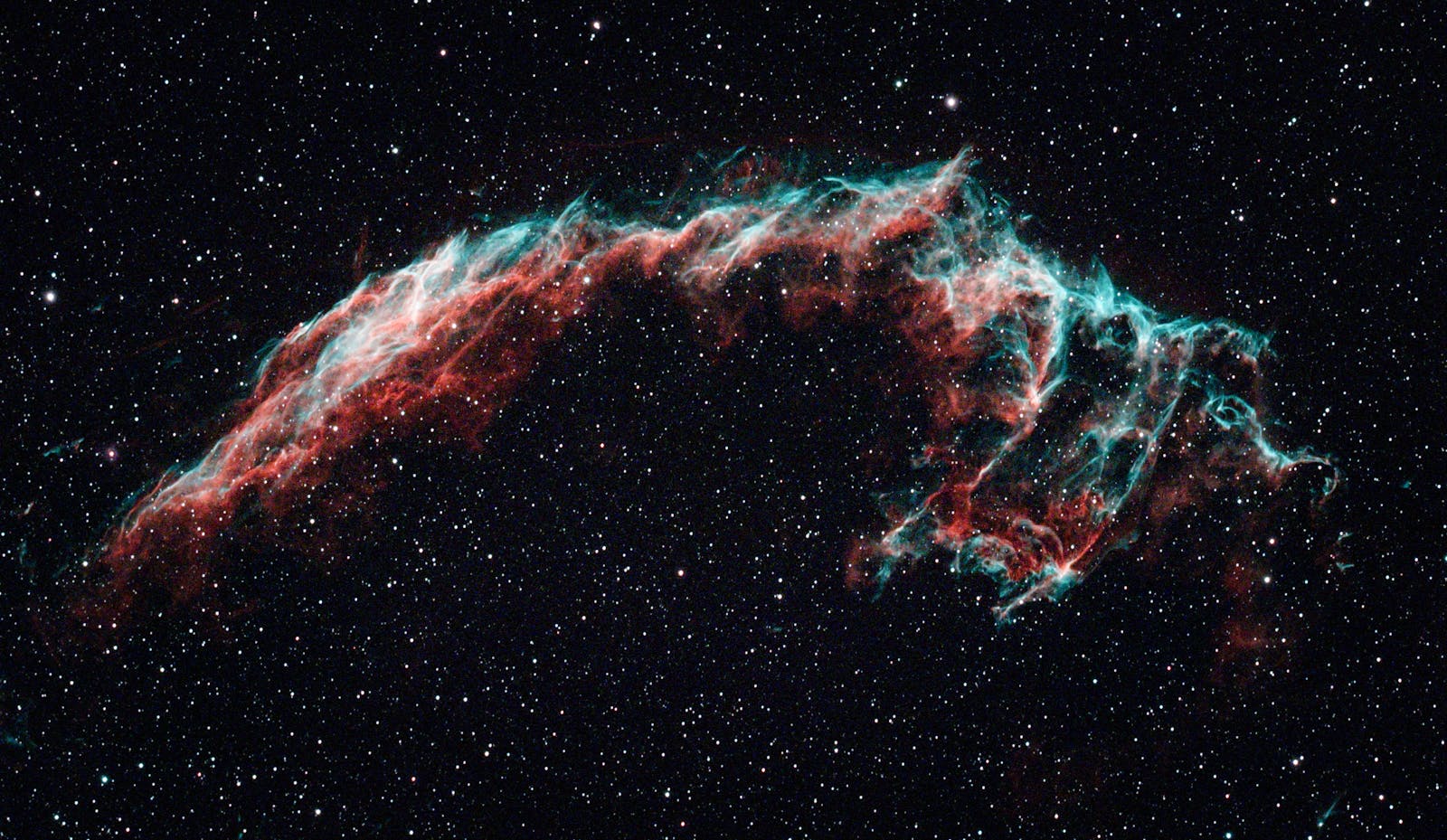 Magnificent view of the Veil Nebula with vibrant colors against the cosmos.